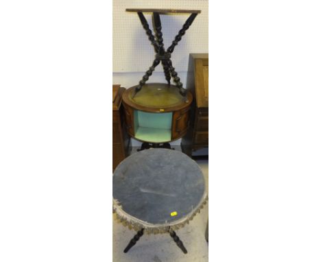 A matched pair of ebonised gypsy tables on bobbin turned supports