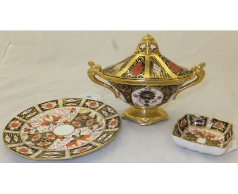 Three pieces of Royal Crown Derby to include an oval sucrier and cover, a plate and a trinket dish