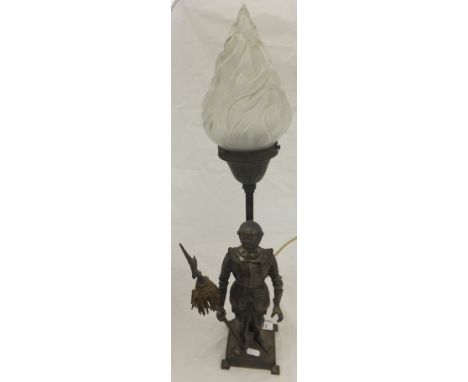 A 20th Century spelter flaming torch table lamp with knight in armour guard decoration