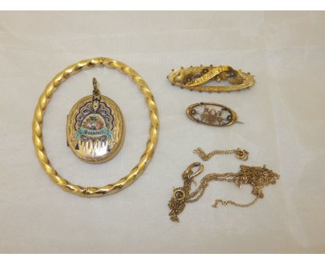 A box containing a 9 carat gold bangle of twisted form, two gold bar brooches, one inscribed "Mizphah", various gold chains a