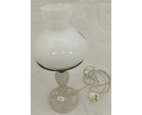 A late 19th / early 20th Century cut glass table lamp with milk glass shade