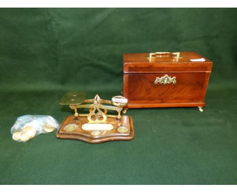 George III mahogany and barber pole string tea caddy and a set of postal scales with brass weights