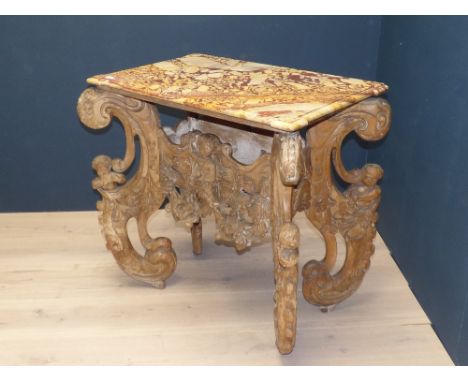 C17th / C18th carved wood marble top console table in the manner of William Kent, the base with scroll cherubic and flower he