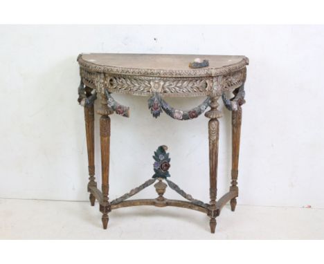 Louis XVI style Carved Oak Demi-lune Console Table, the pierced carved apron with attached carved foliate swags , turned carv