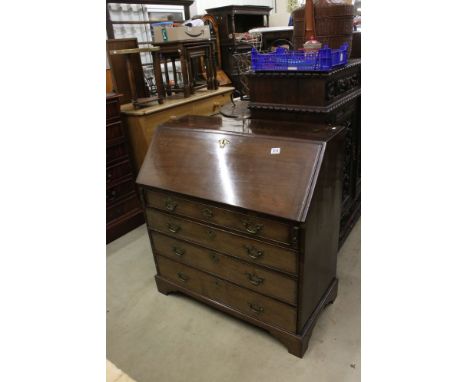 George III Mahogany Bureau, the fitted interior over four long drawers and bracket feet, with two keys, 93cm wide x 100cm 