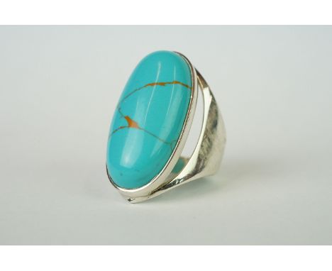 Silver ring set with large turquoise cabochon 