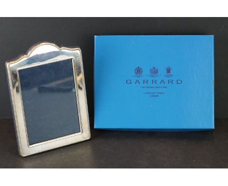 A fully hallmarked sterling silver photograph frame with original Garrard retail box. 