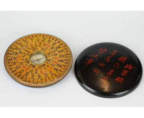 Chinese pocket compass in lacquered wooden case with character marks to top and bottom, 8cm diameter 