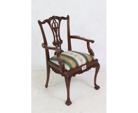 Miniature Chair in the form of a Carved Chippendale style Elbow Chair, 30cm wide x 50cm high 