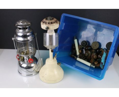 Two vintage storm lanterns together with a small group of lighting accessories. 