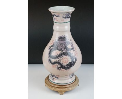 Japanese Ceramic Vase decorated with dragons, 37cm high on a wooden stand 