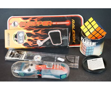 A group of mixed collectables to include Rubik's cube, Micky Mouse watch, Swatch watch and a Raleigh Chopper mirror. 