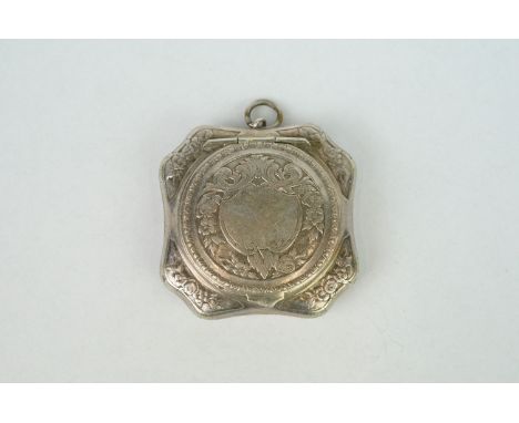 White metal patch box, hexagonal form with circular hinged lid containing a mirror, floral, foliate and ivy decoration in rel