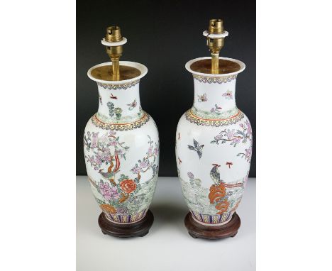 Pair of 20th century Chinese Ceramic Baluster Famille Rose Lamp Bases decorated with birds and insects within foliage, 43cm h