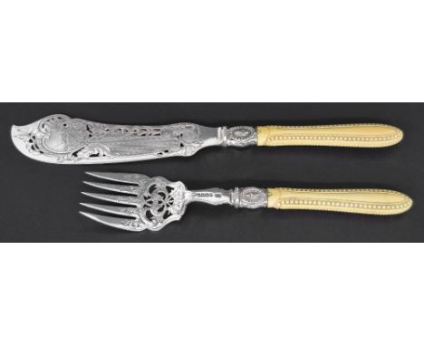 Pair of attractive Victorian silver blade fish servers, with ivorine beaded handles and fine engraved blades depicting a land