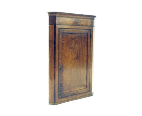 Georgian oak and mahogany crossbanded hanging corner wall shelf with a single panelled door, 28" wide, 42" high