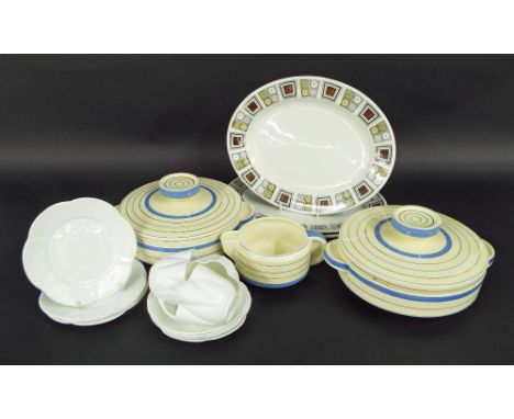 Clarice Cliff Wilkinson Ltd pair of Odilon shape tureens and sauce boat decorated with pale blue and gold bands; together wit