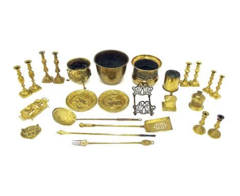 Assorted brass items including five pairs of candlesticks, an inkstand with two glass inkwells, fire tools and decorative pla