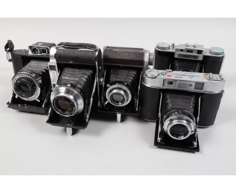 A Tray of Folding Cameras, a Semi Minolta, shutter working, body G, some fading, bellows G, with Rokker 75mm f/3.5 lens, elem