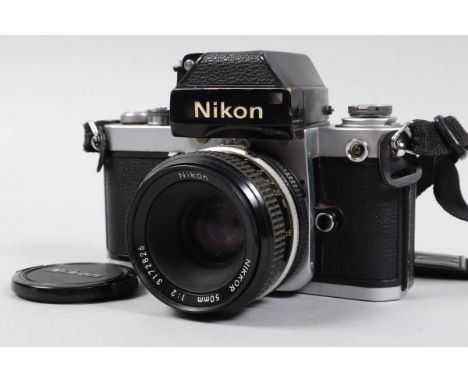 A Nikon F2 Photomic Camera, black, serial no 7452353, shutter working, self timer working, meter unresponsive, body G, with N