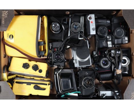 A Tray of Compact Cameras, including a Ricoh Auto Half SE, Auto Half E, Auto 126, untested, an Olympus trip 35, a Cosmic 35, 