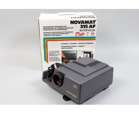 A Braun Novamat 315 AF Slide Projector, with 85mm Color-Paxon lens, elements G-VG, body G-VG, with slide magazines, in maker'