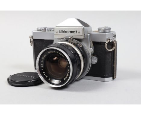 A Nikon Nikkormat FTN Camera, chrome, serial no 3596564, shutter working, meter responsive, self timer working, body G, some 