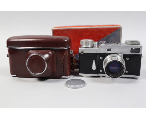 A Gomz Leningrad Camera, four screw model, serial no 006166, spring motor drive working, shutter working, body G, slight wear