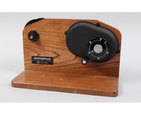 An Olympus OM System 250 Film Loader, film loader for 24 x 36mm format, standard 35mm 100 foot bulk film rolls, with large sp