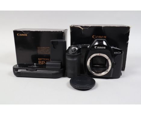 A Canon EOS 1n Camera body, body G-VG, untested, in maker's box, with boxed Canon BP-E1 battery Grip, VG, untested