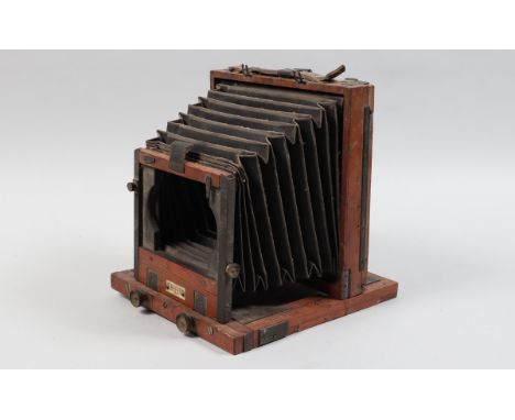 A Stanley and Co Dublin Half-Plate Mahogany and Brass Field Camera, front standard located by twin plates, slots and clamps, 