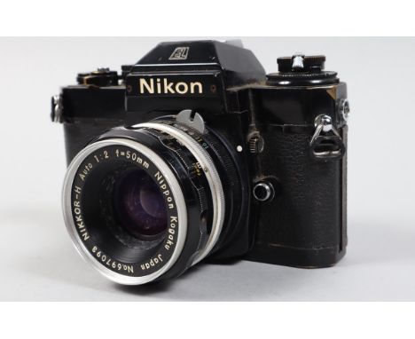 A Nikon EL2 Camera, black, serial no 7940782, shutter working, meter responsive, body F, brassing to edges, some oxidisation 