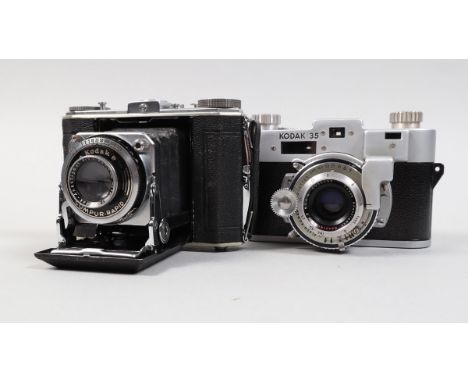 Two Kodak Cameras, a Kodak Duo Six-20 Series II folding camera, serial no 206475K, shutter sluggish on slow speeds, body G, b