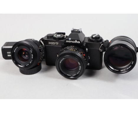 A Minolta XD7 SLR Camera and Lenses, black, shutter working, meter responsive, self timer working, body G-VG, light marks to 