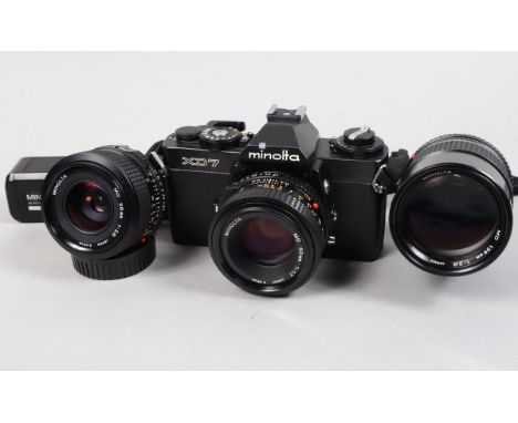 A Minolta XD7 SLR Camera and Lenses, black, shutter working, meter responsive, self timer working, body G-VG, light marks to 