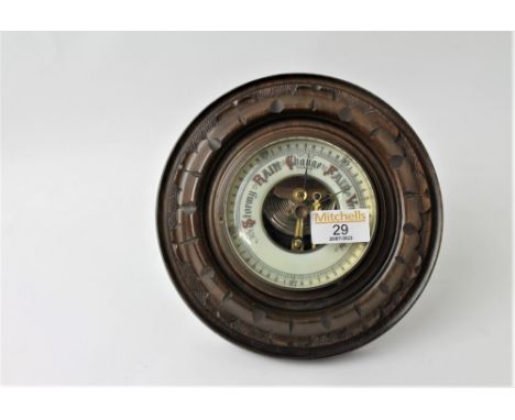 Barometer in round wooden surround, marked to back JG