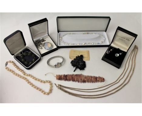 Collection of costume jewellery including a Devon Head rose brooch made from a real leaf and a beetle bracelet 