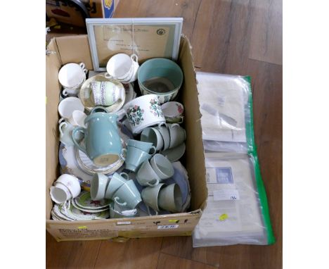 Box of teacups and saucers and bundle of documents 