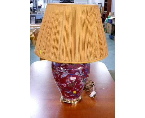 Oriental style lamp with bulbous red base and cream shade, 70 cm high