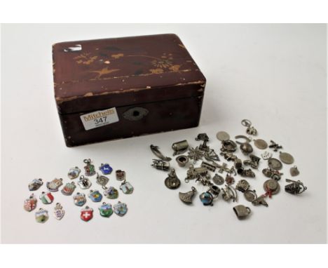 44 charms and jewellery box containing 18 silver and enamel charms in a Japanese lacquered box  