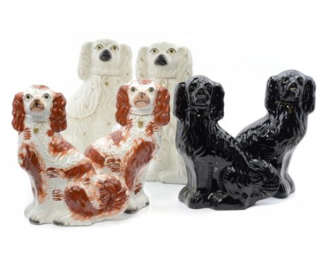 THREE PAIRS OF STAFFORDSHIRE EARTHENWARE MODELS OF SPANIELS, 19TH C  32 and 38cm h ++The lot in good condition with some very