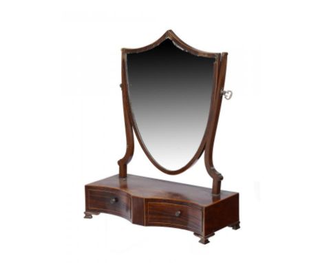 A GEORGE III MAHOGANY SHIELD SHAPED DRESSING MIRROR, C1800 crossbanded in rosewood, the double cavetto base fitted with drawe