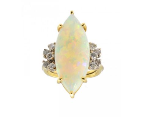 A FINE MARQUISE OPAL RING WITH DIAMOND SHOULDERS, C1980 in gold marked 18K, opal 11 x 22mm approx, 8.8g gross  size M ++In fi