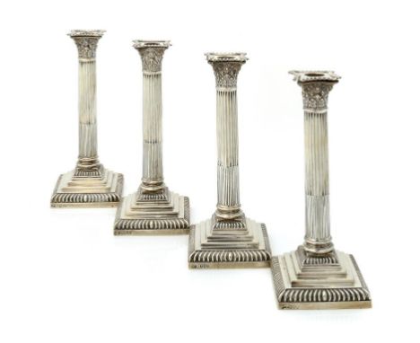 A SET OF FOUR VICTORIAN SILVER COLUMN CANDLESTICKS  with nozzles,    27.5cm h, by The Goldsmiths & Silversmiths Co, London 18