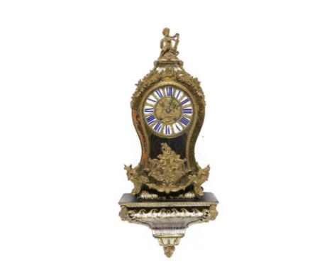 A FRENCH ORMOLU MOUNTED TORTOISESHELL AND CUT BRASS 'BOULLE' BRACKET CLOCK AND BRACKET, 19TH C the case surmounted by a child