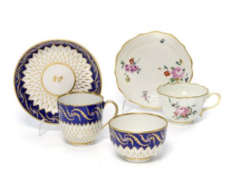 A DERBY OGEE TEACUP AND SAUCER AND A BLUE AND GILT TRIO, C1775 & C1785-90 saucers 12 & 12.5cm diam, anchor and D in gilt or p