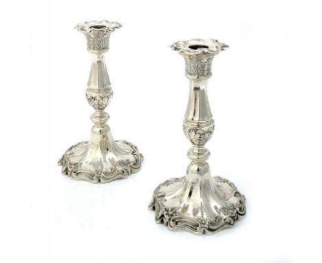 A PAIR OF VICTORIAN SILVER CANDLESTICKS,  with nozzles, crested, 20cm h, marked on edge, inside sconce and on nozzle, by Henr