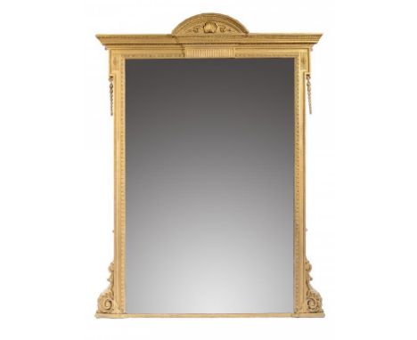 A VICTORIAN GILTWOOD AND COMPOSITION PIER GLASS, C1870 with arched, shell centred pediment and fluted frieze, the unbevelled 
