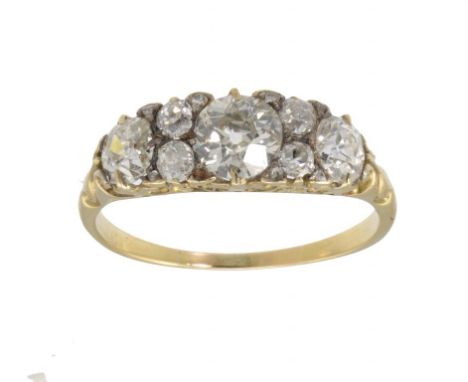 A DIAMOND RING  with round and cushion shaped diamonds in gold, gross weight, 3.5g, size R ++A good ring in good condition, t