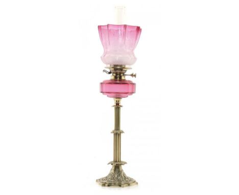 A VICTORIAN BRASS OIL LAMP, C1880   with faceted cranberry glass fount and Young's Special brass burner, etched cranberry gla